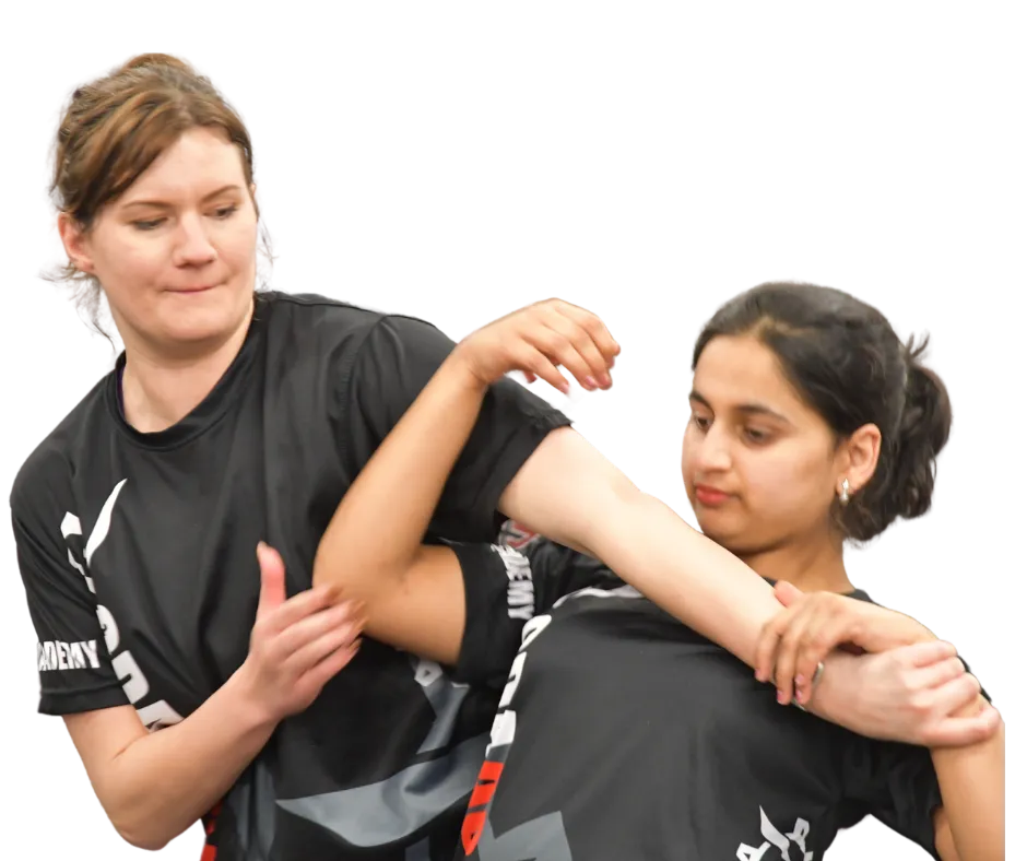 Two women practicing self defence in a class in Cheltenham