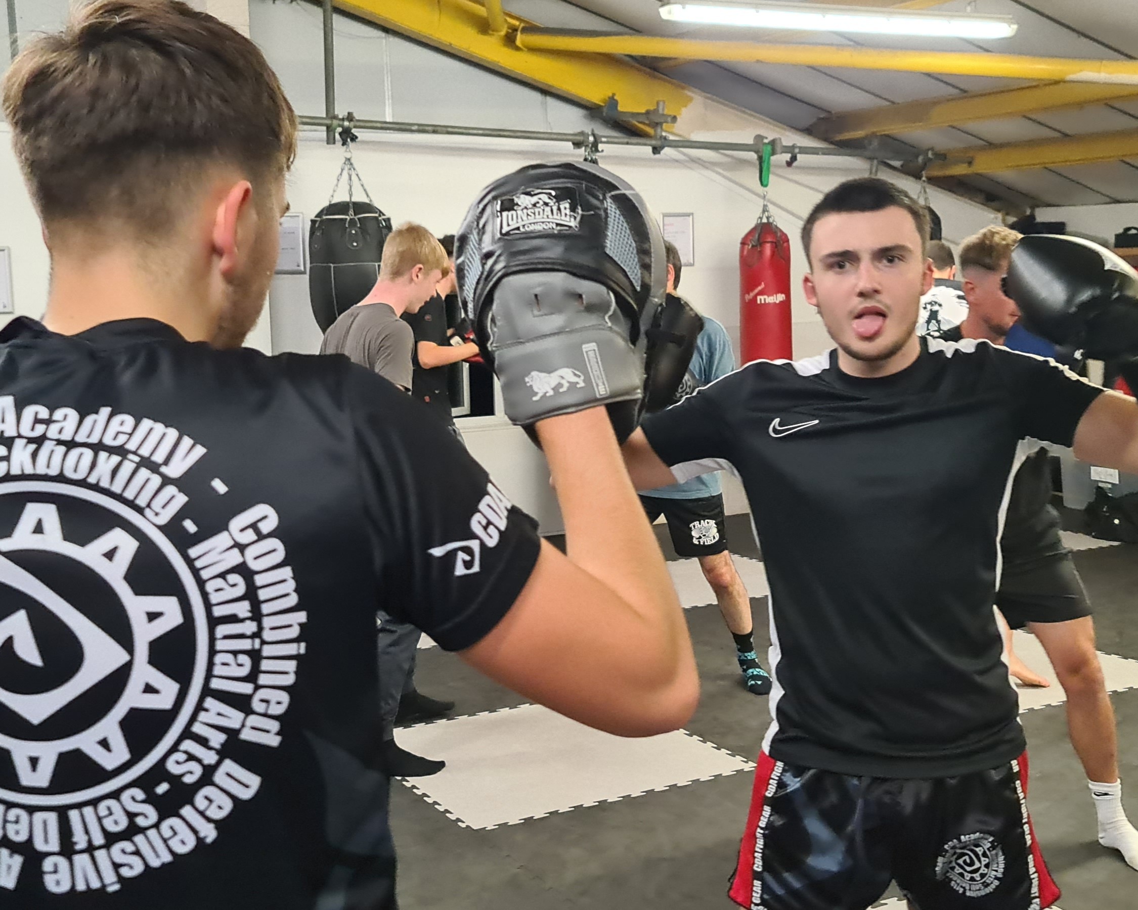 Kickboxing student after a training session, showing improved mood and focus