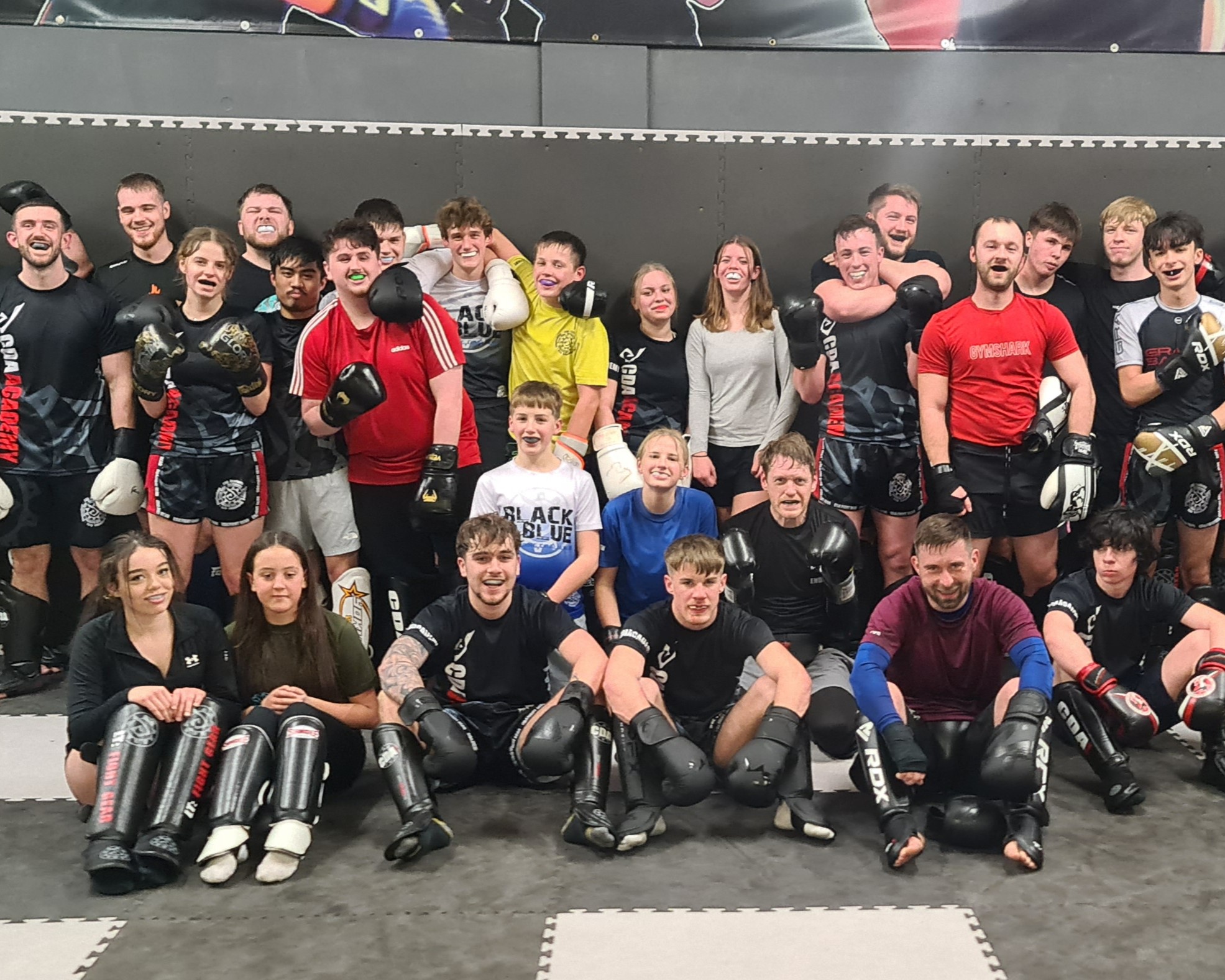 Group of beginner kickboxing students training together at CDA Academy