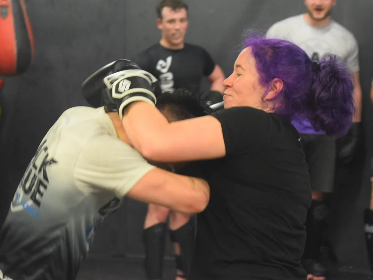 Beginner practising kickboxing techniques useful for self-defence
