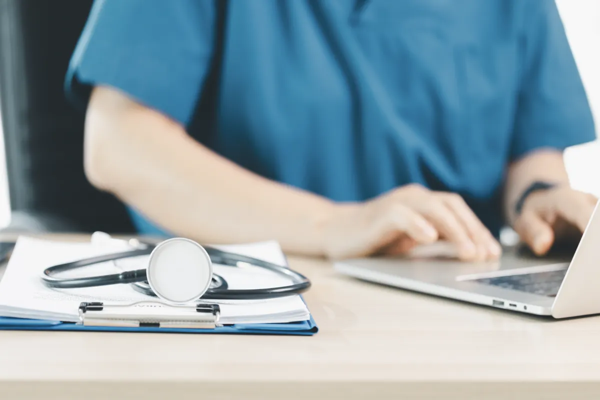 a doctor is working on his hipaa compliant crm
