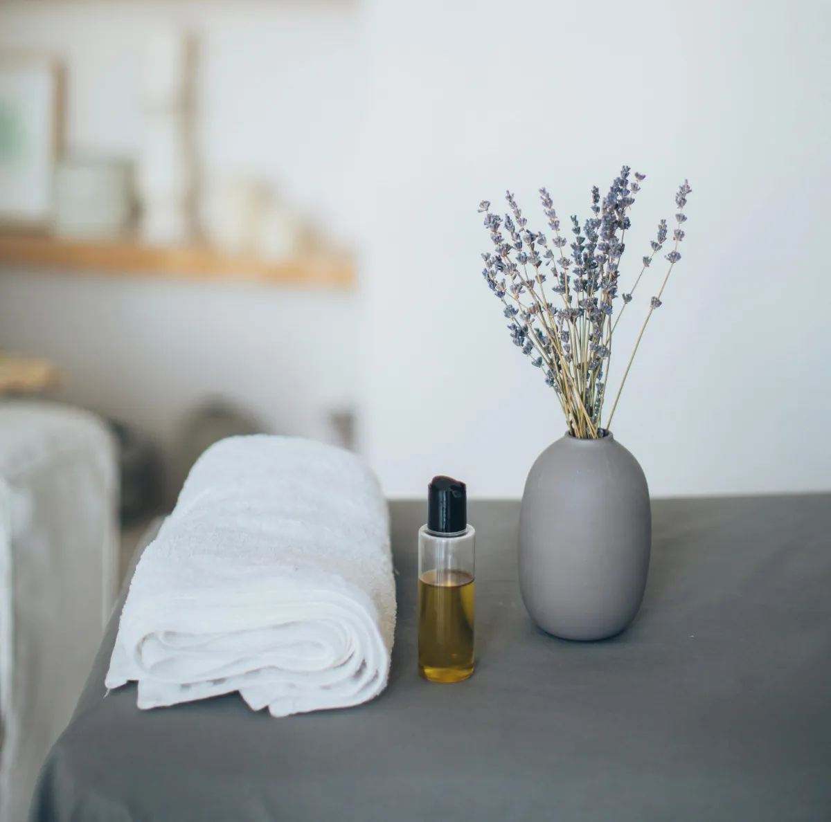 Candle and towel on a wooden table