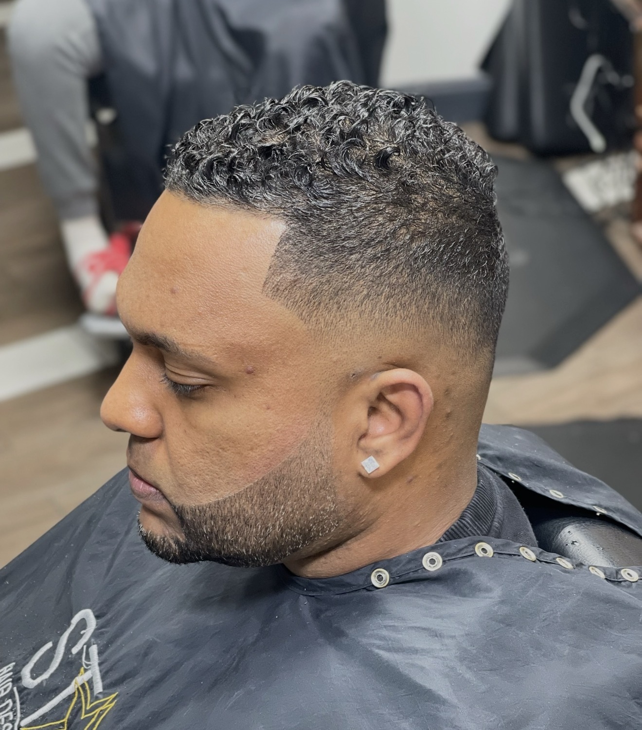 Dominican barbershop fade detail and sharp hairline