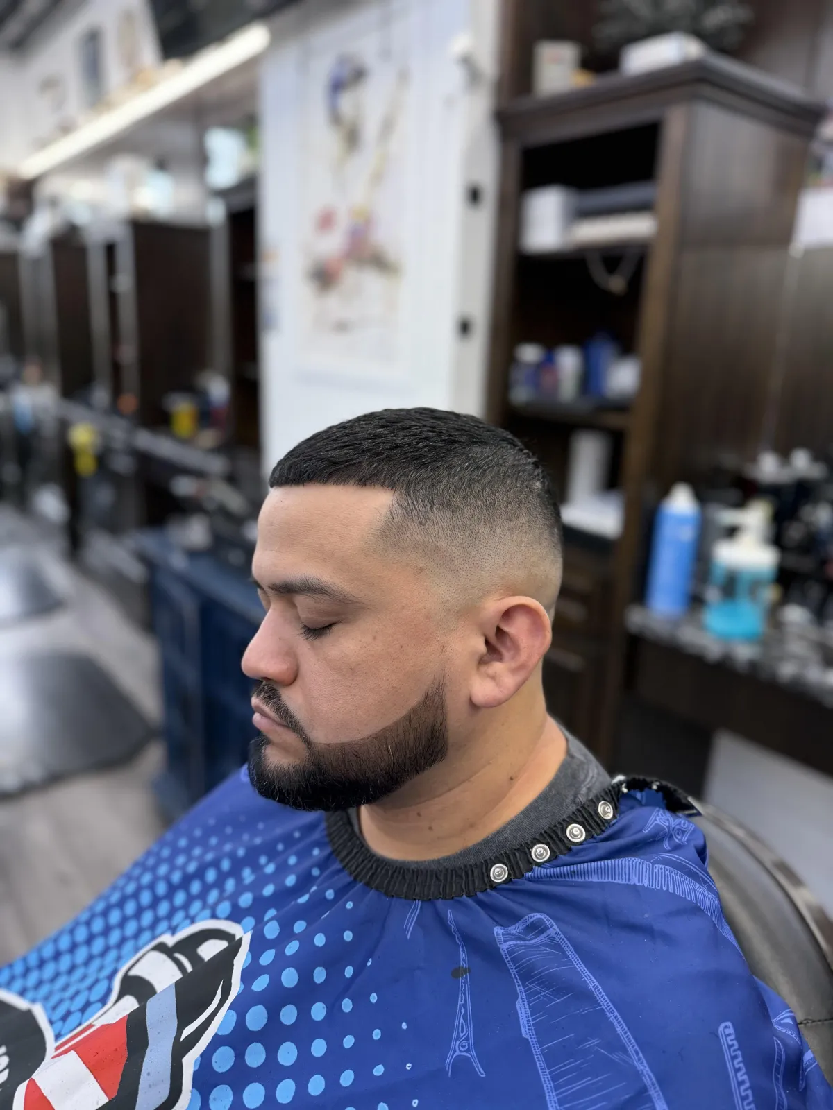 Master barber finishing a clean shave and trim