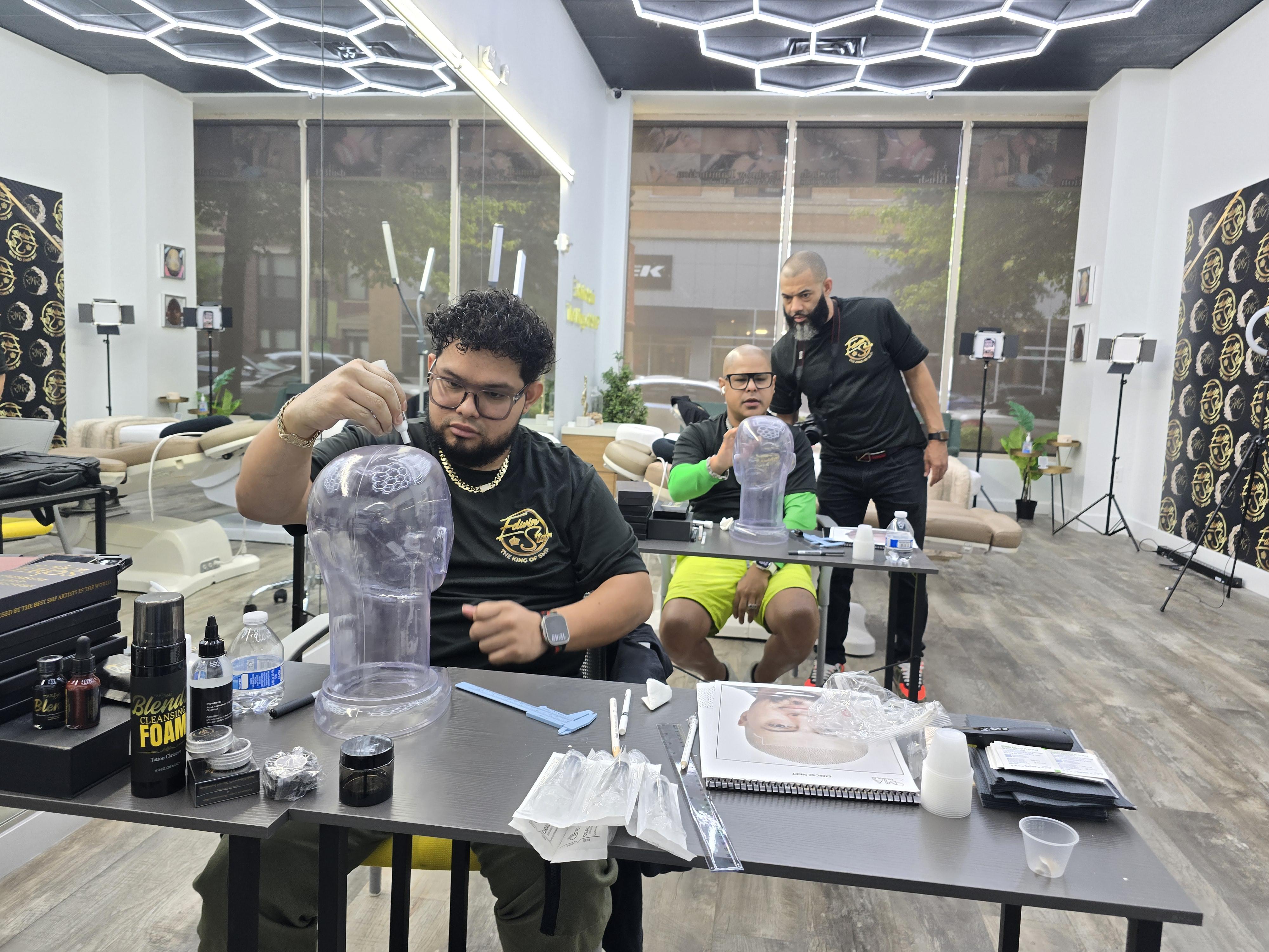 Hands using a digital caliper to measure metal part.