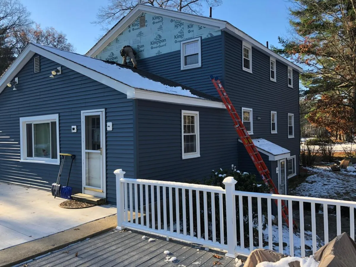 Winter siding installation with Kingspan GreenGuard insulation by McCarthy Exteriors LLC on a residential home in Southern New Hampshire