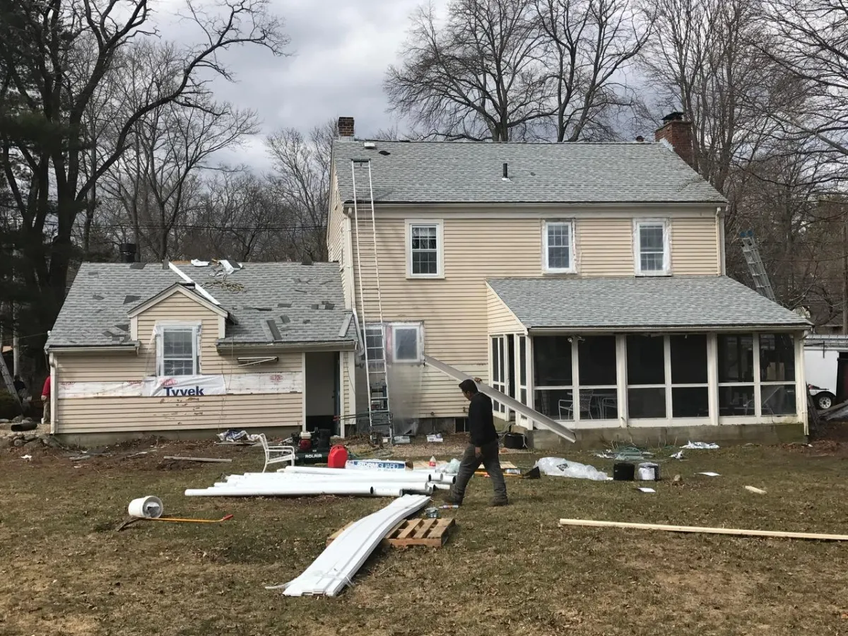 Back view of full roofing and siding replacement on a New Hampshire home by McCarthy Exteriors LLC