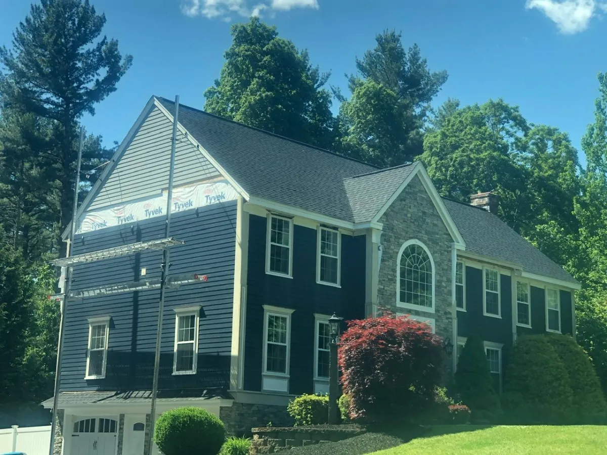 Multi-color siding installation & replacement job on a newer home in Sothern NH by McCarthy Exteriors LLC