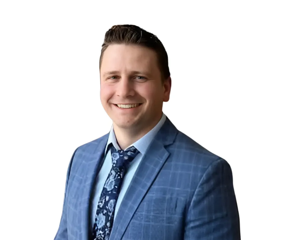 Warm, empathetic portrait of a community health educator smiling gently.