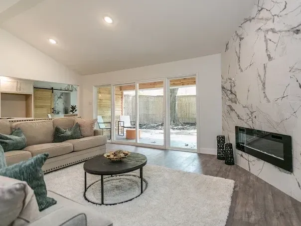 Spacious Arlington, TX bathroom with double vanity, freestanding tub, walk-in shower, modern finishes, and natural light.