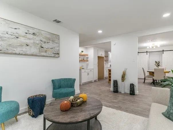 Spacious Arlington, TX bathroom with double vanity, freestanding tub, walk-in shower, modern finishes, and natural light.