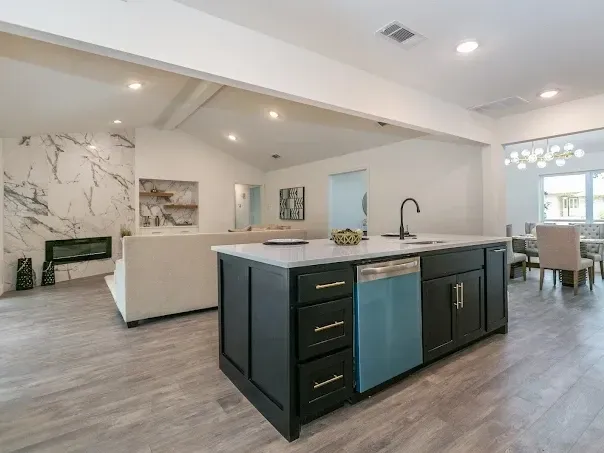 Modern Arlington bathroom featuring large windows, sleek fixtures, marble countertops, and stylish tiled shower.