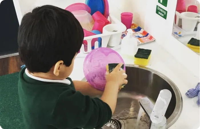 Preschoolers engaged in hands on activities at Little Companions Leicester in Leicester Nursery
