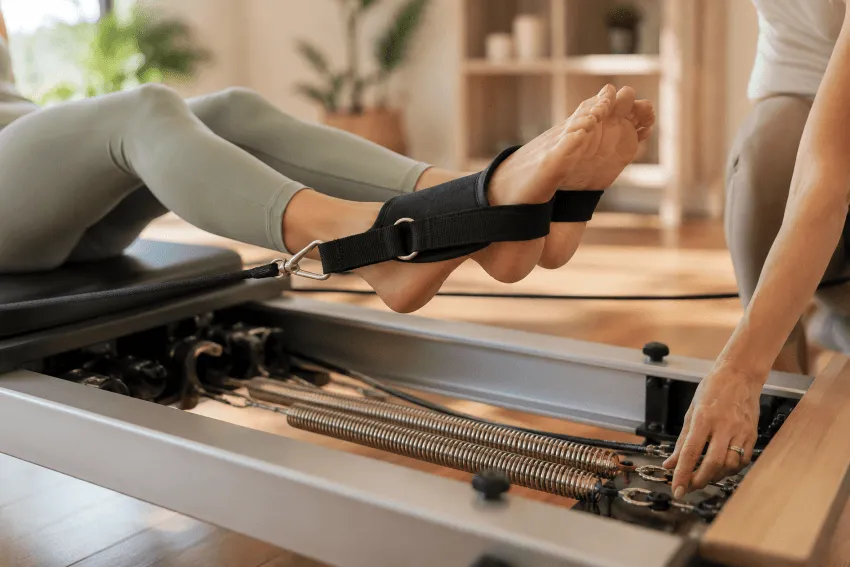 Close-up of reformer Pilates technique during a private in-home session in Perth