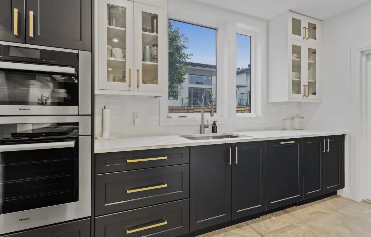 a modern kitchen with a bar and stools