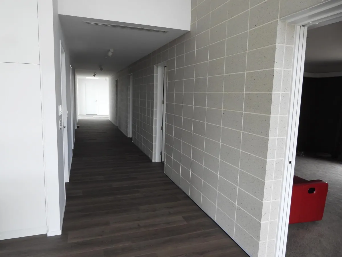 Interior hallway with concrete block wall