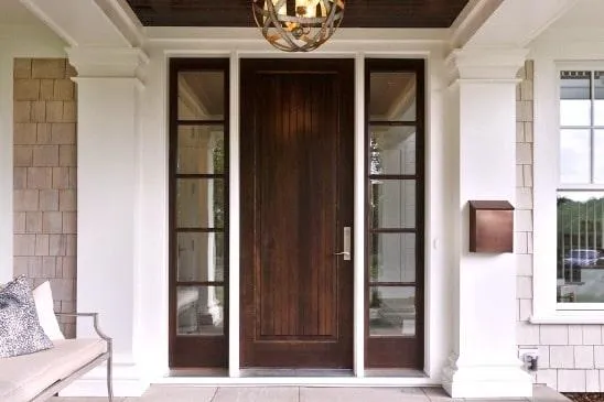 a wooden door with glass panes