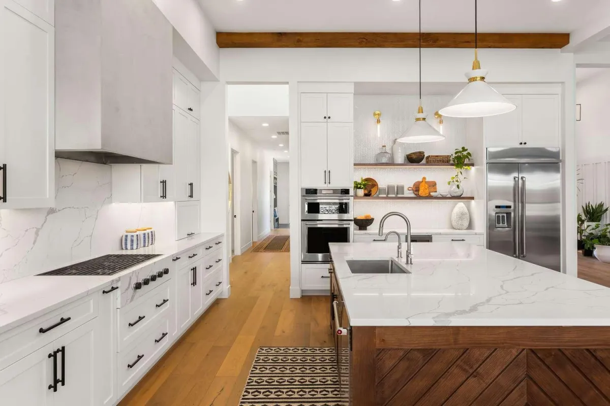 a white kitchen with lots of cabinets