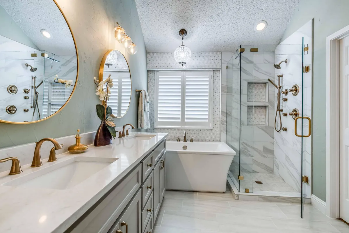 a newly remodeled bathroom with glass doors