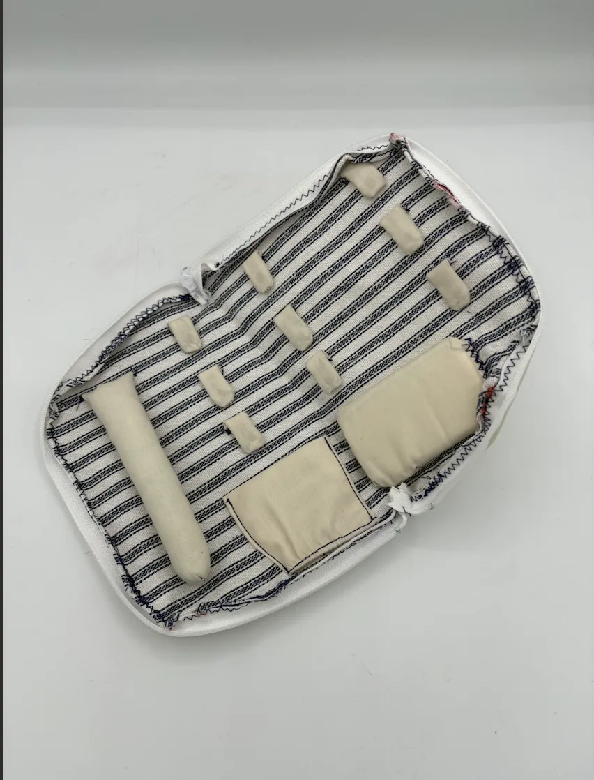 Customer photo of LustreCarry jewelry bag packed for travel.