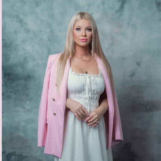 Lucia Lewis in a pink blazer