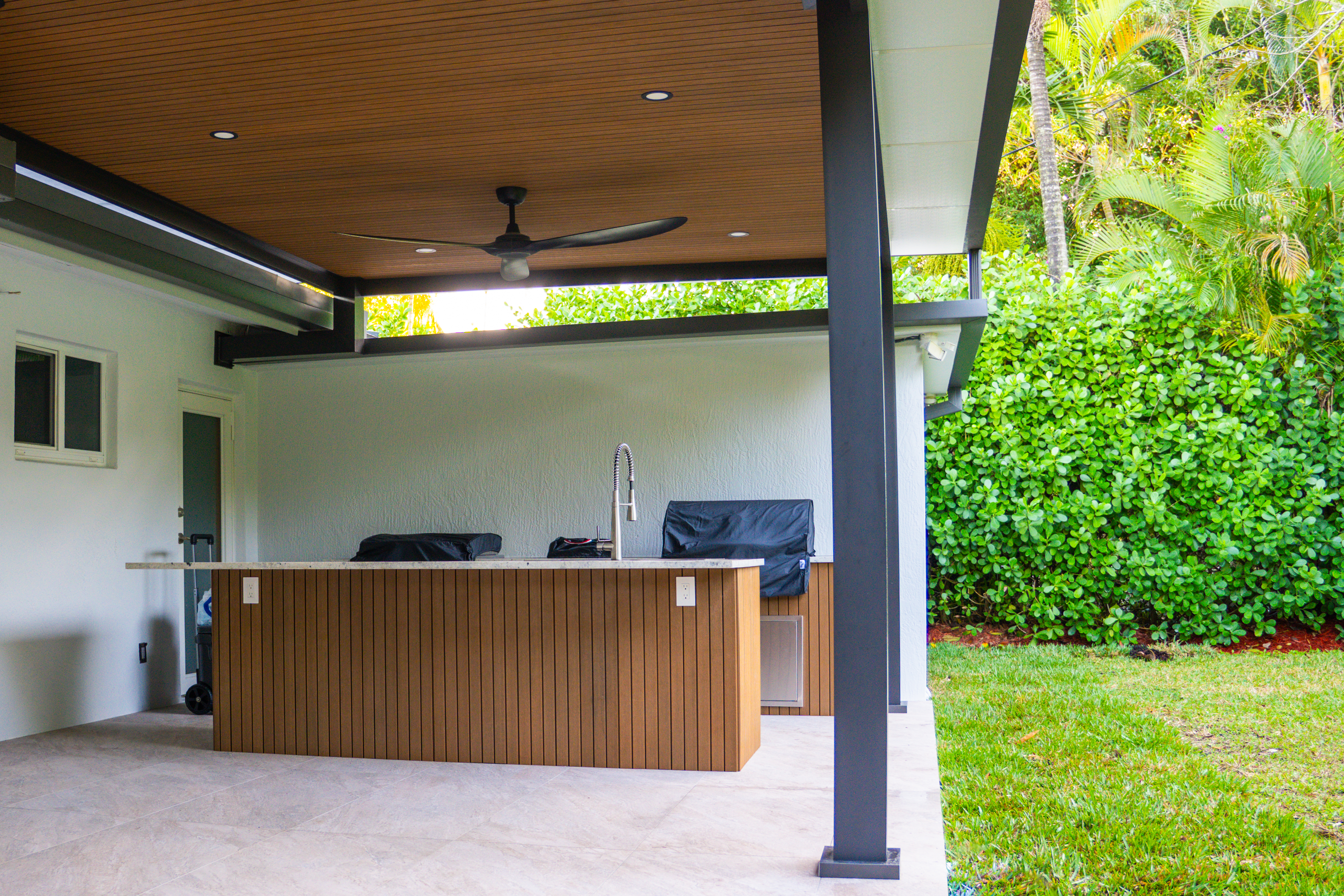 Backyard pergola over patio in Broward County