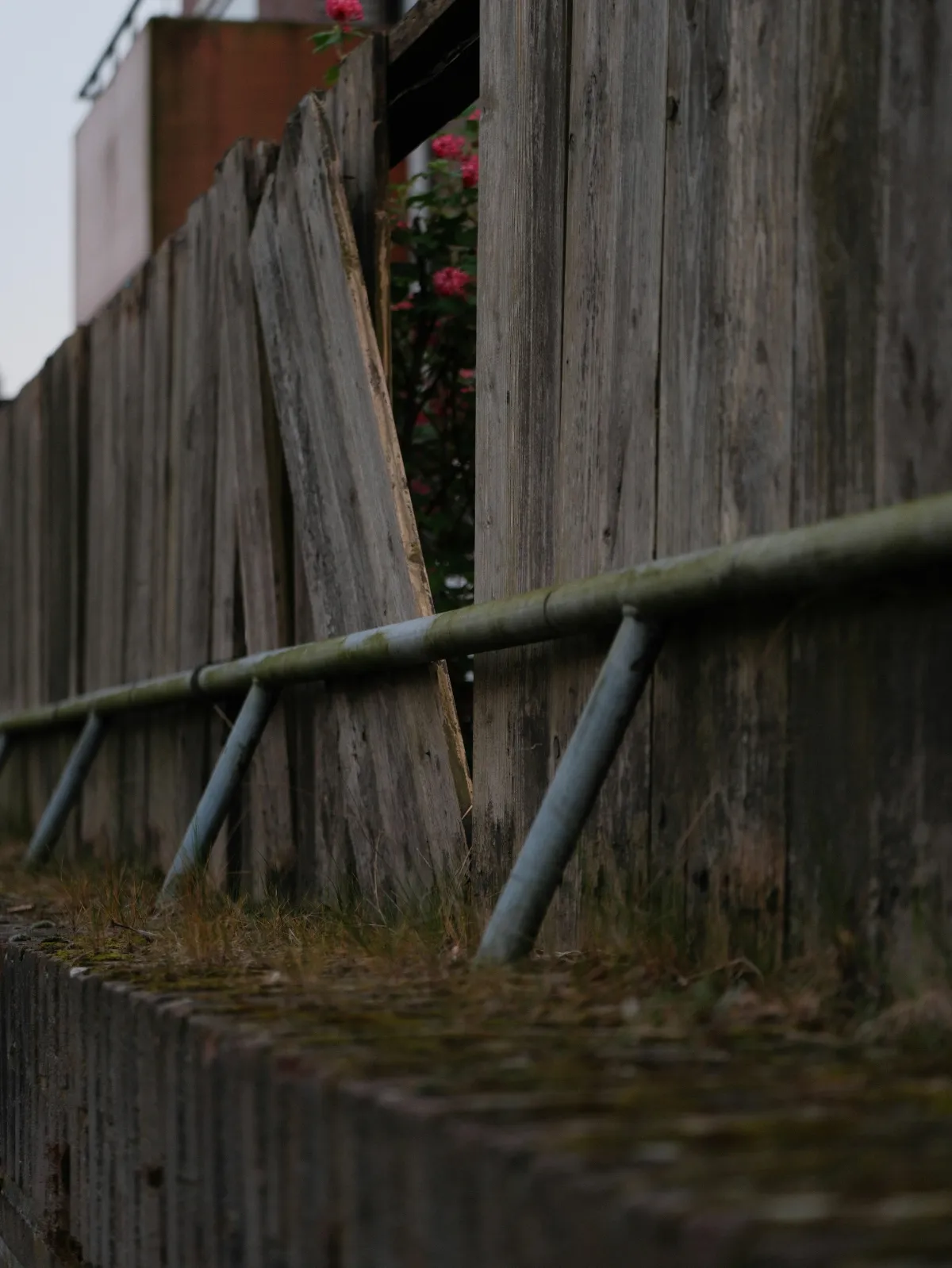 Fence repair in Gosport - storm damaged panel being fixed by Four Seasons Fencing & Landscaping