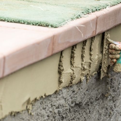 patio builders planning tile flooring transitions