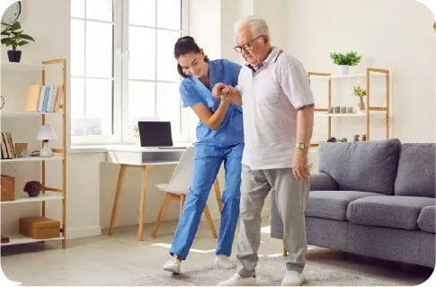 A white nurse helping an elderly white man to walk