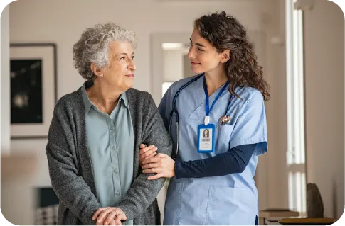A white nurse assisting a White elderly lady