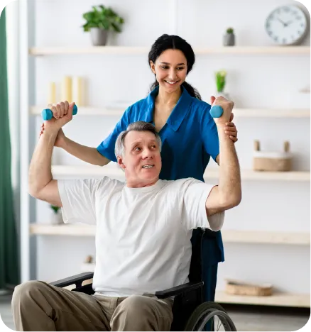 A white nurse helping a disabled senior white man to lift his hands
