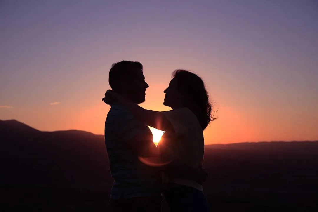 couple hugging at sunset