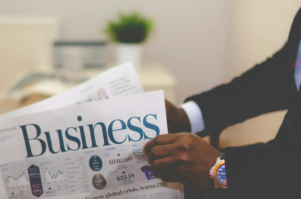 man reading business news paper.