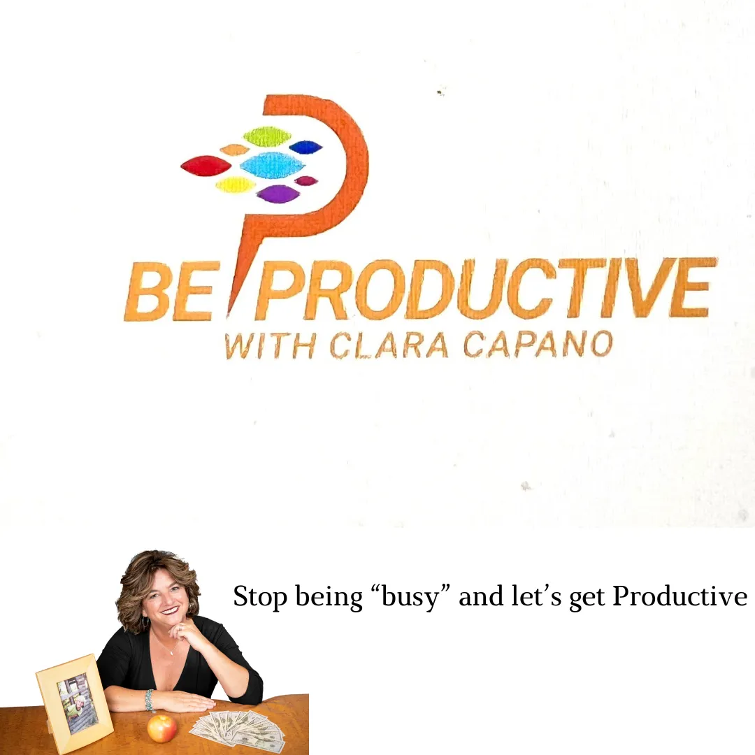 A framed photo of a child rests on a table next to an alarm clock. In the background, Clara Capano  sits on a chair holding a mug and a notebook.