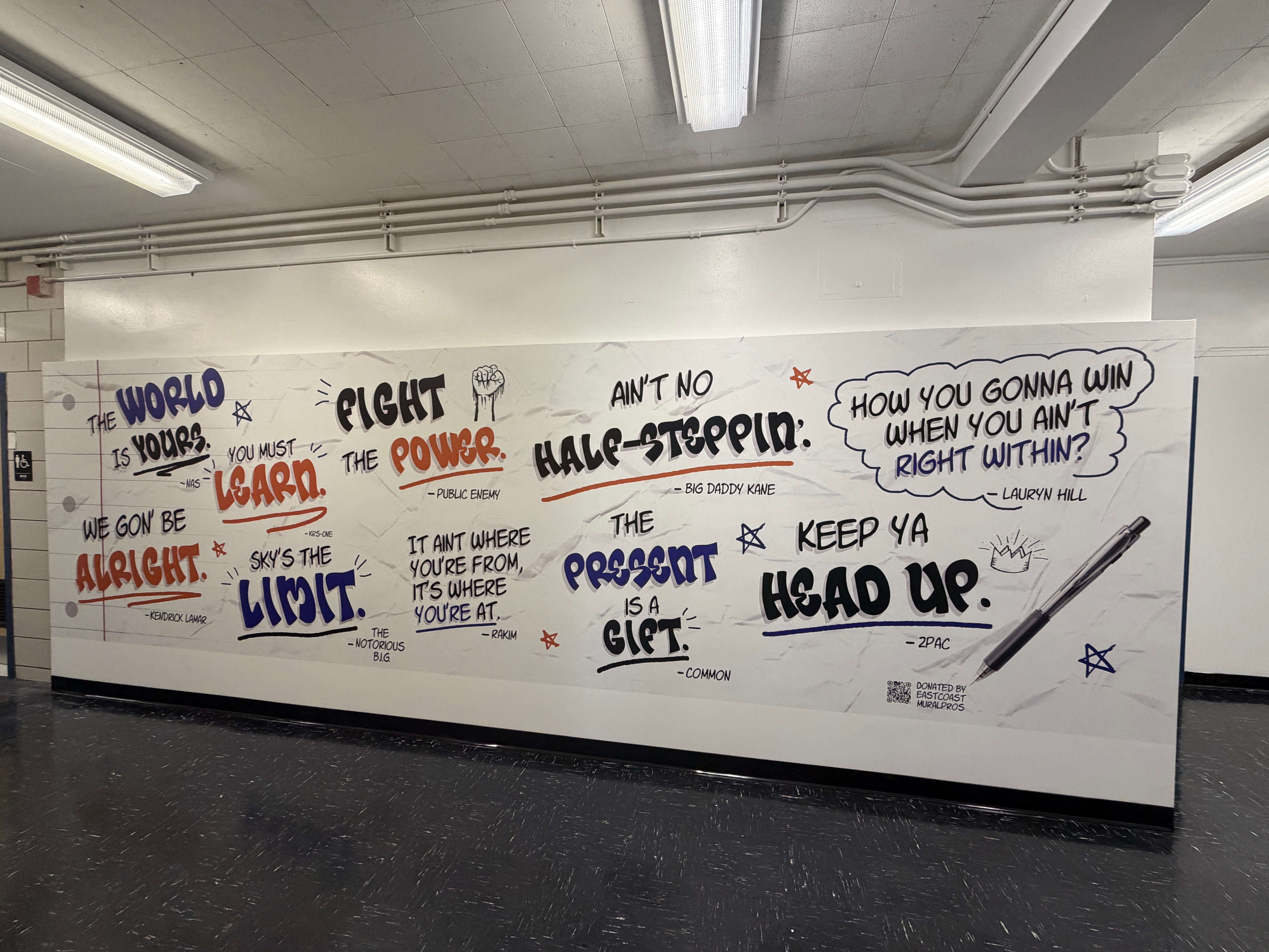 Custom motivational quotes wall mural with hip hop legends printed in a school by East Coast Mural Pros