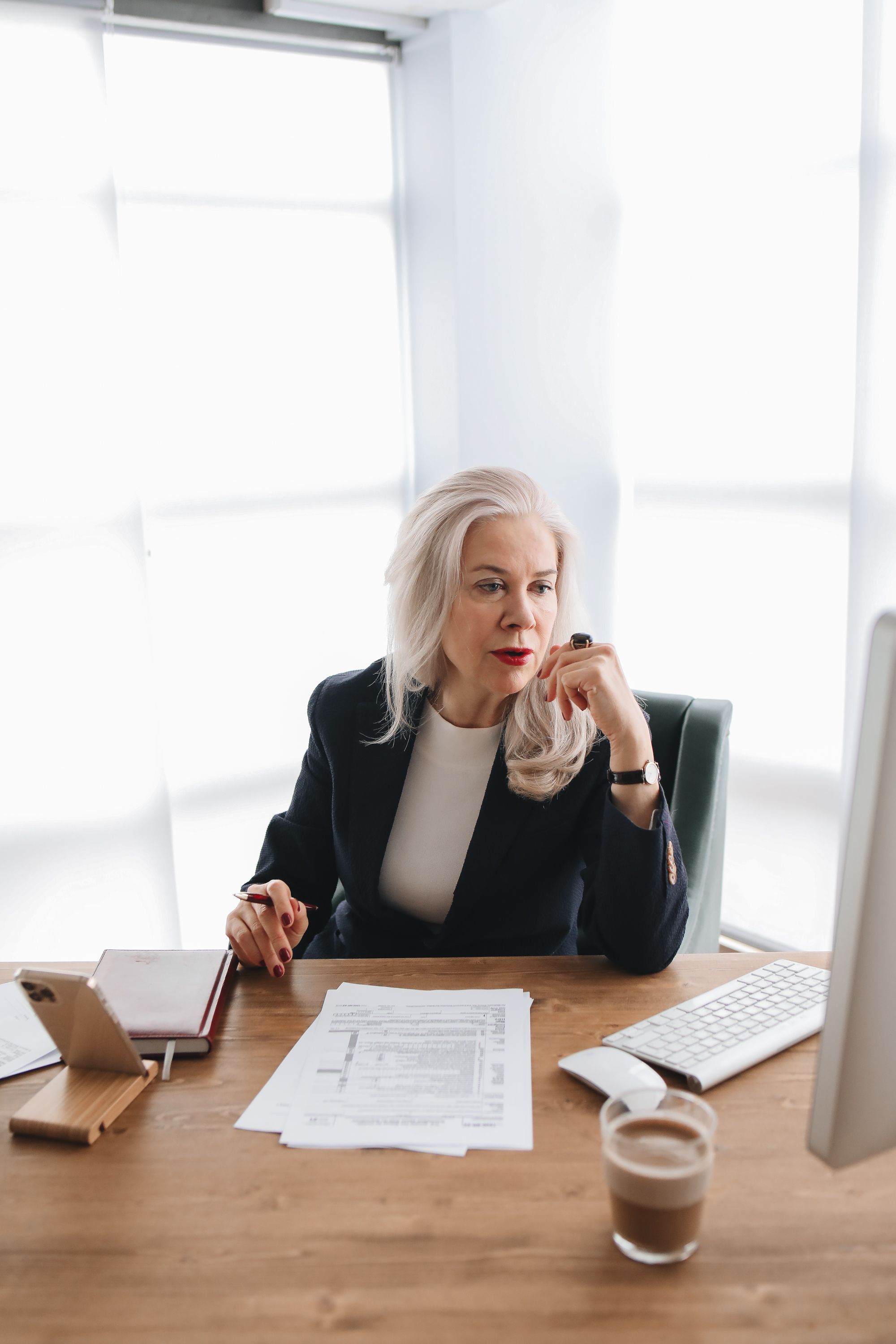 Brand alignment audit for established service providers. A business owner reviewing her online presence to find out where her business actually stands.