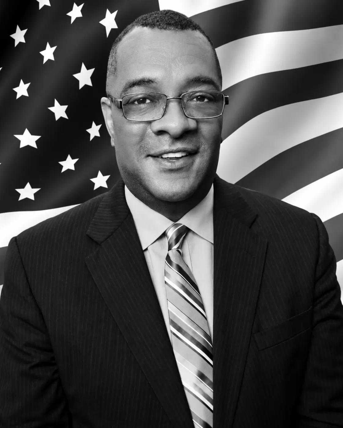 Senior institutional financial advisor in tailored attire, black and white portrait