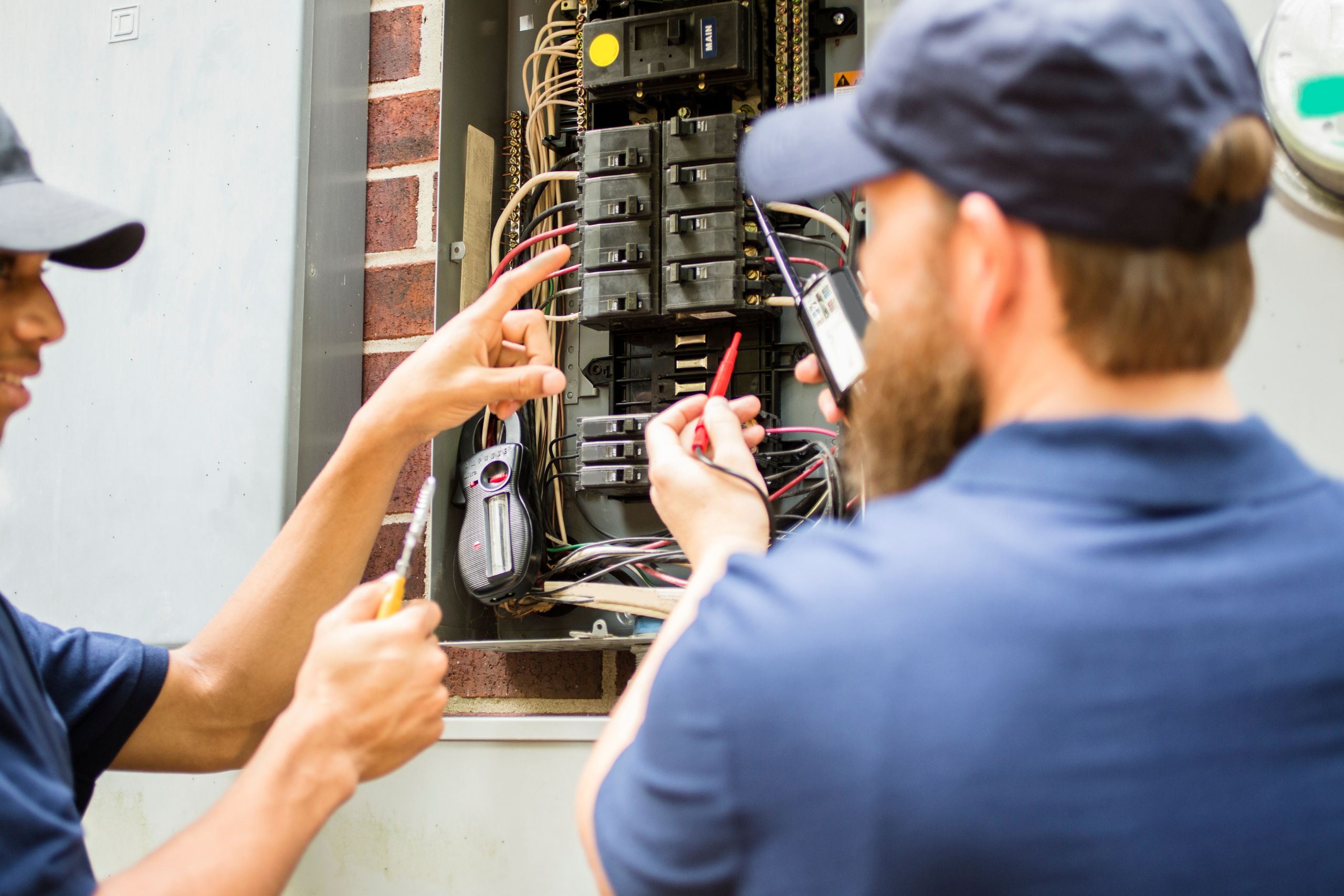 Licensed electrician repairing a residential electrical panel in Austin, TX