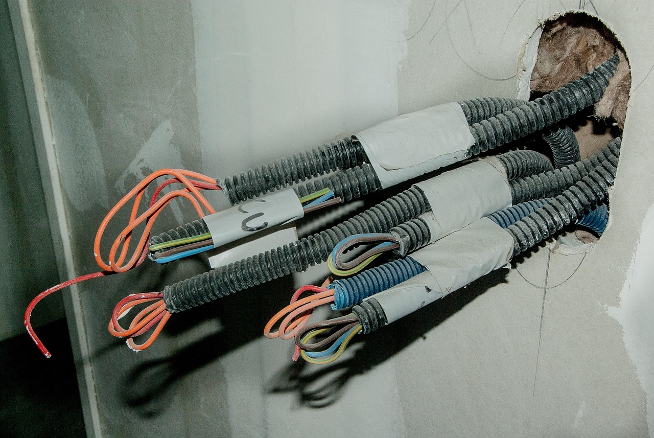 Exposed wires in Georgetown, Texas. Your local electricians provide services for outlet, switch, and wiring repairs.