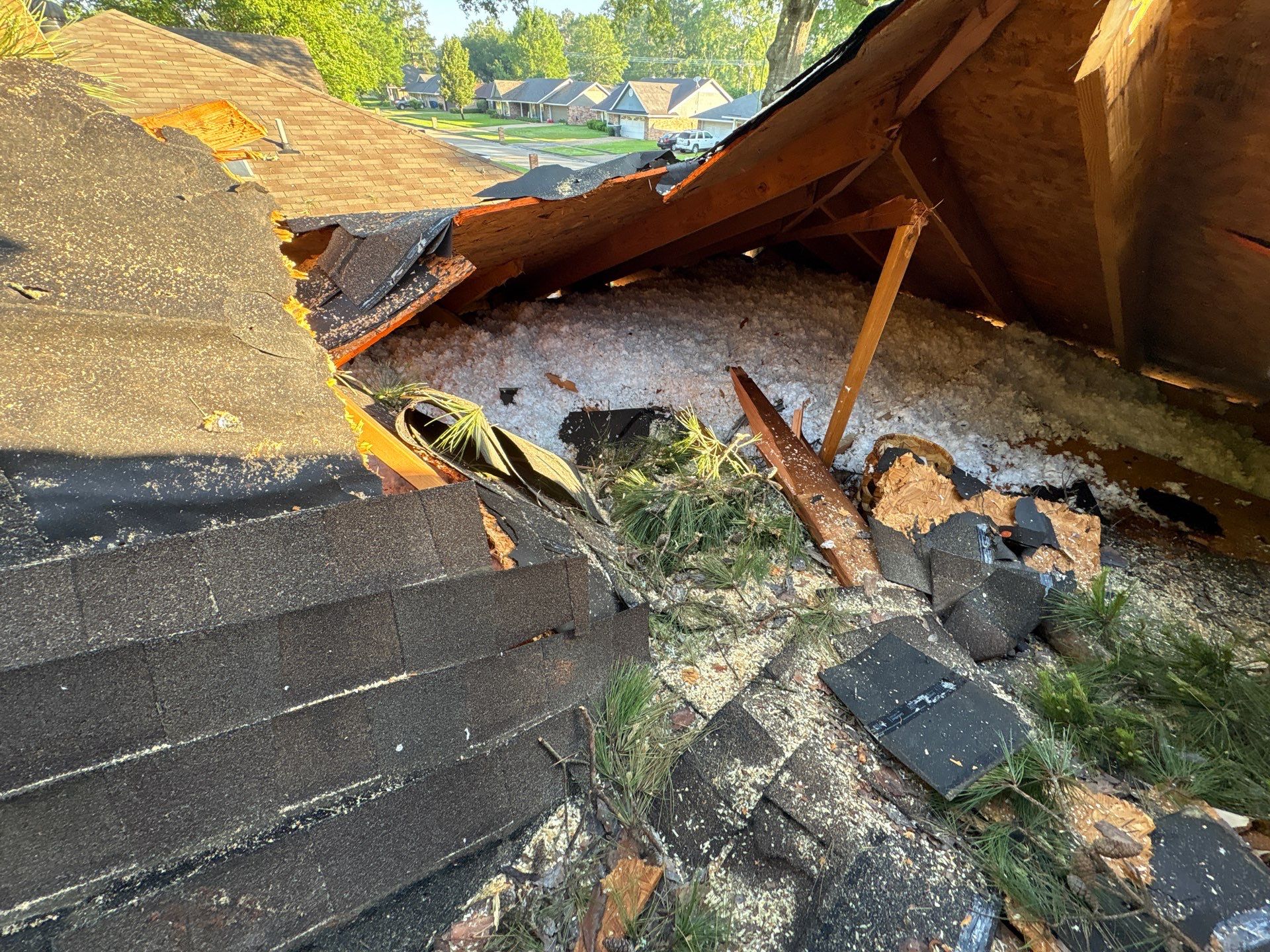 Severe roof collapse and structural damage from storm — Holman Builds emergency storm repair in Northwest Louisiana