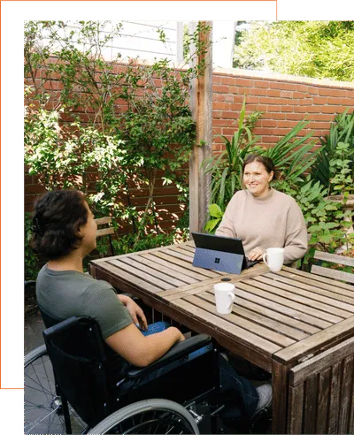 NDIS support wheel chair computer conversation talk table in person