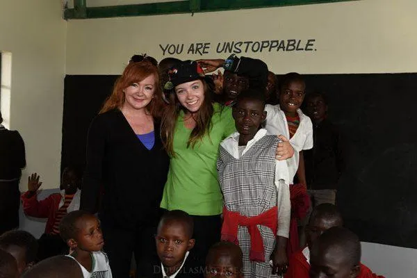silhouette of boy riding bicycle in wheelie during golden hour