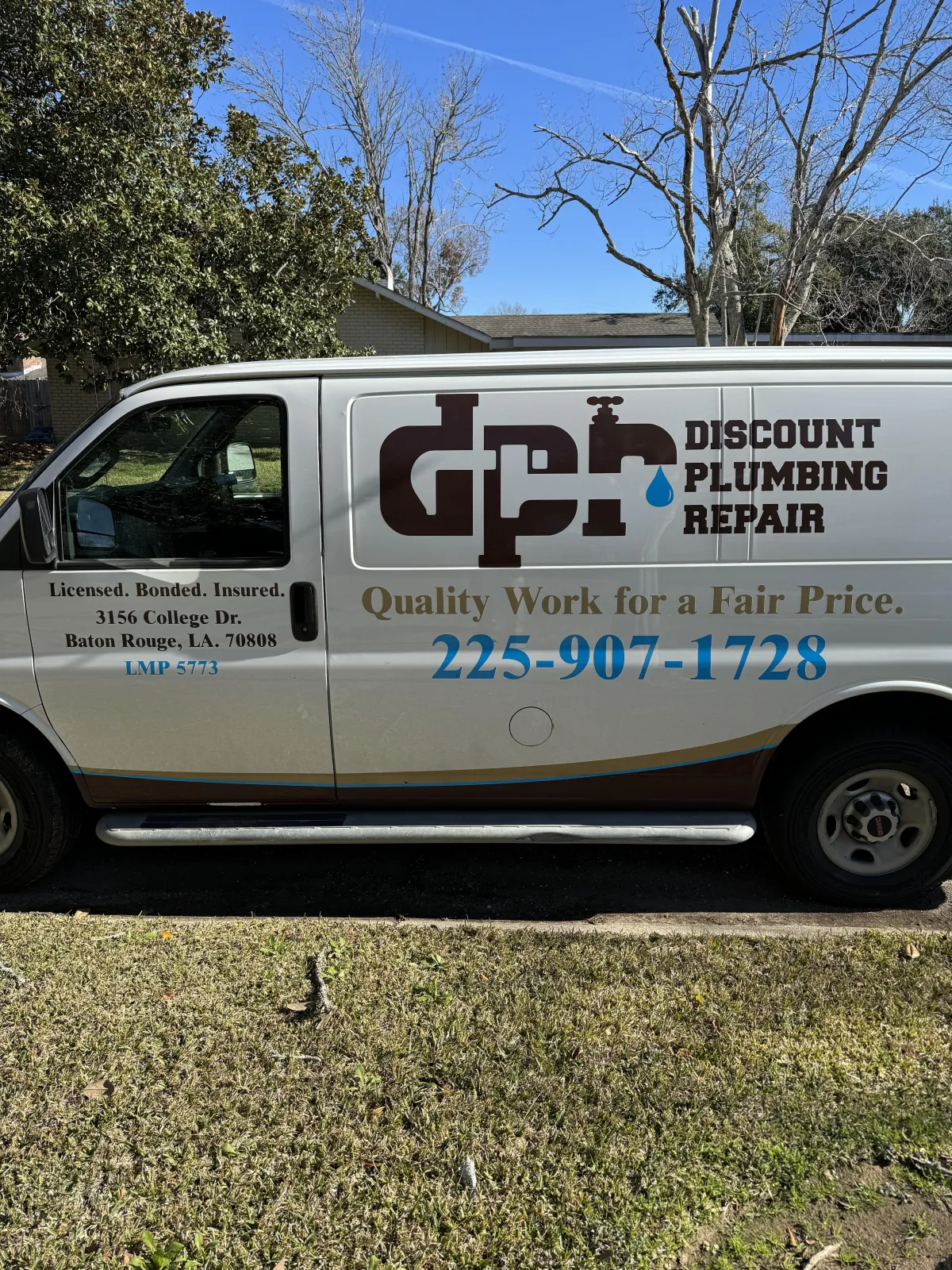 Plumbing van in front of residential home.
