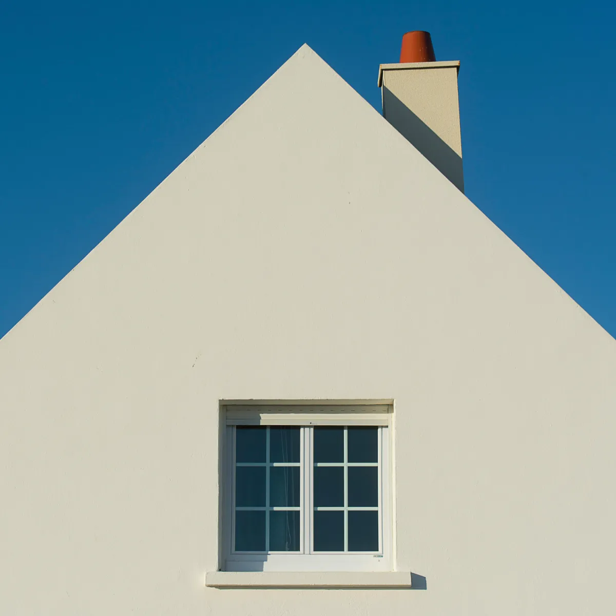 Freshly painted white exterior with smooth finish and clean architectural lines.