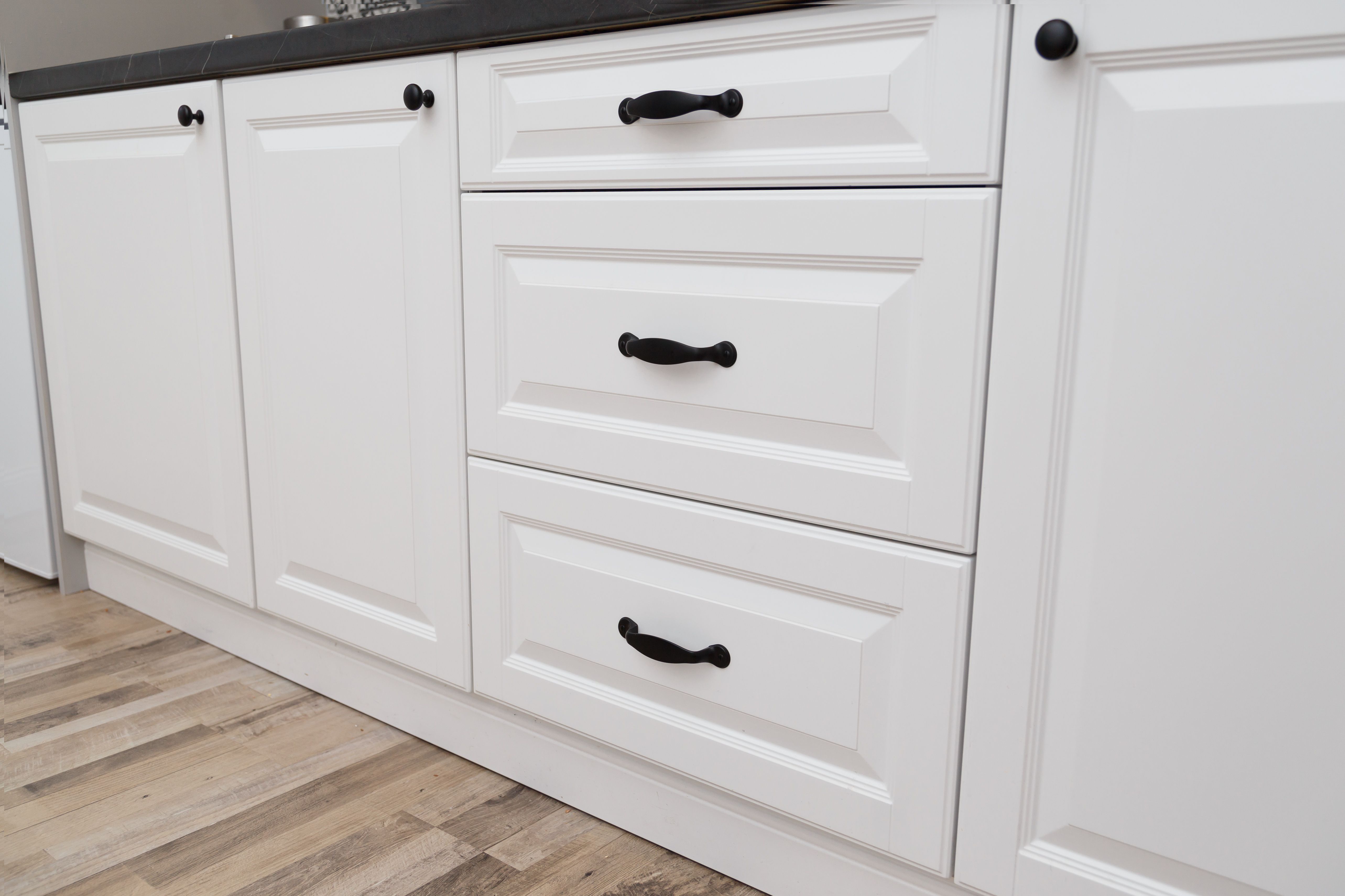 Refinished kitchen cabinets with smooth, durable paint applied by Santa Barbara painters.