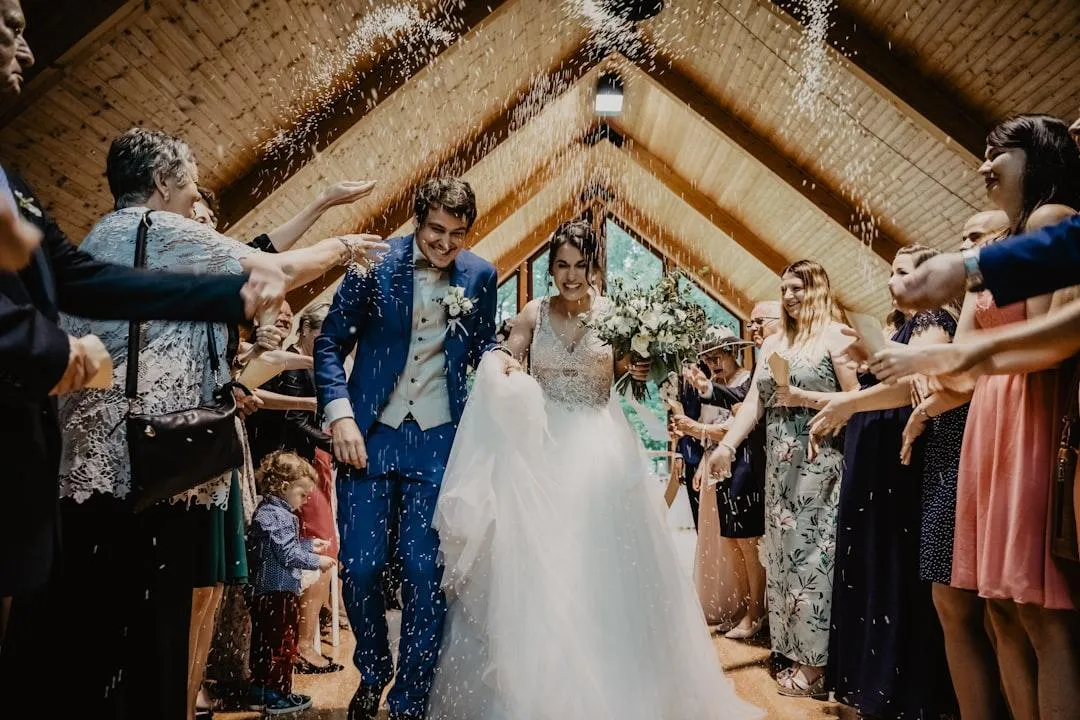 photo of a man and woman newly wedding holding a balloons