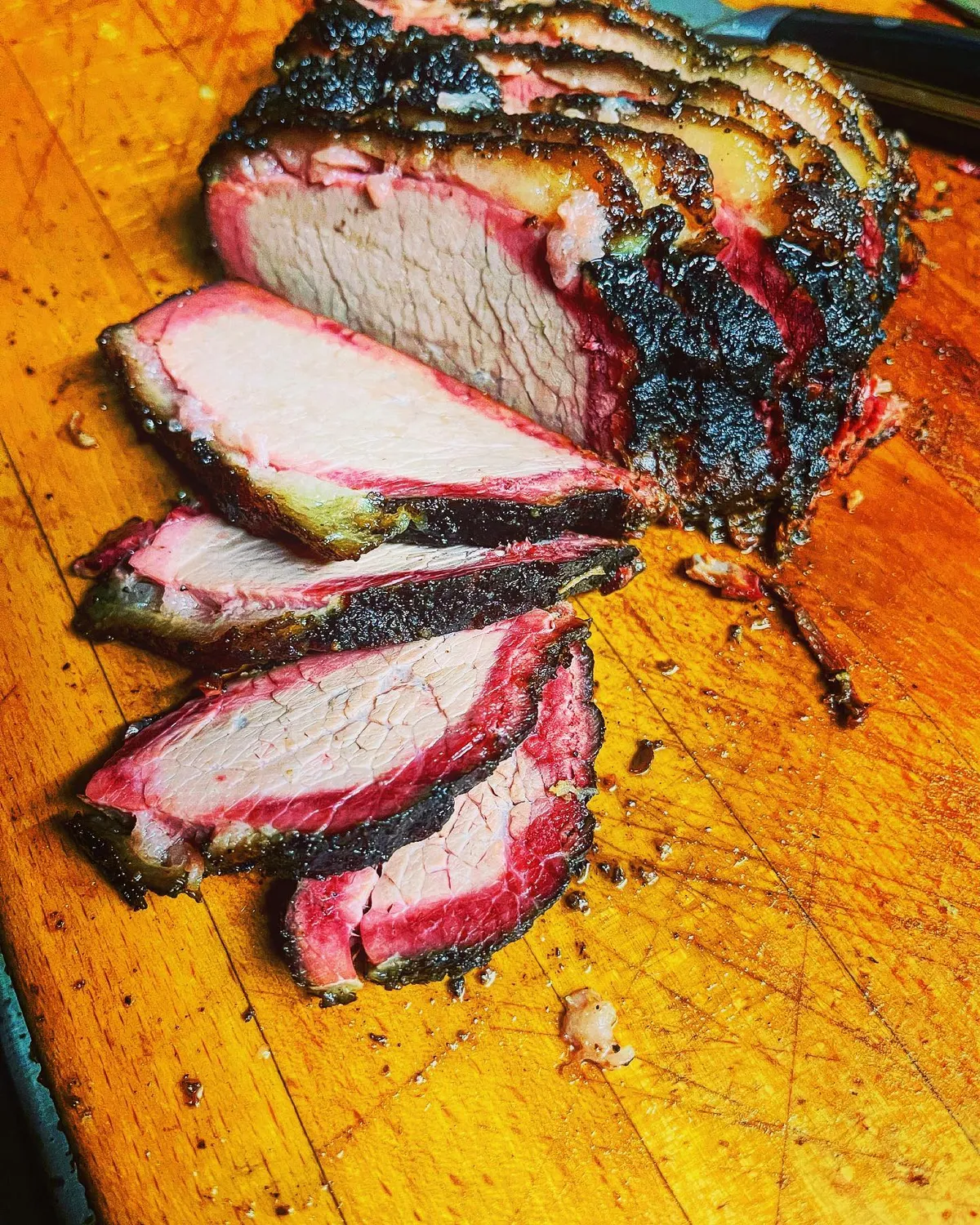 Sliced brisket on a cutting board