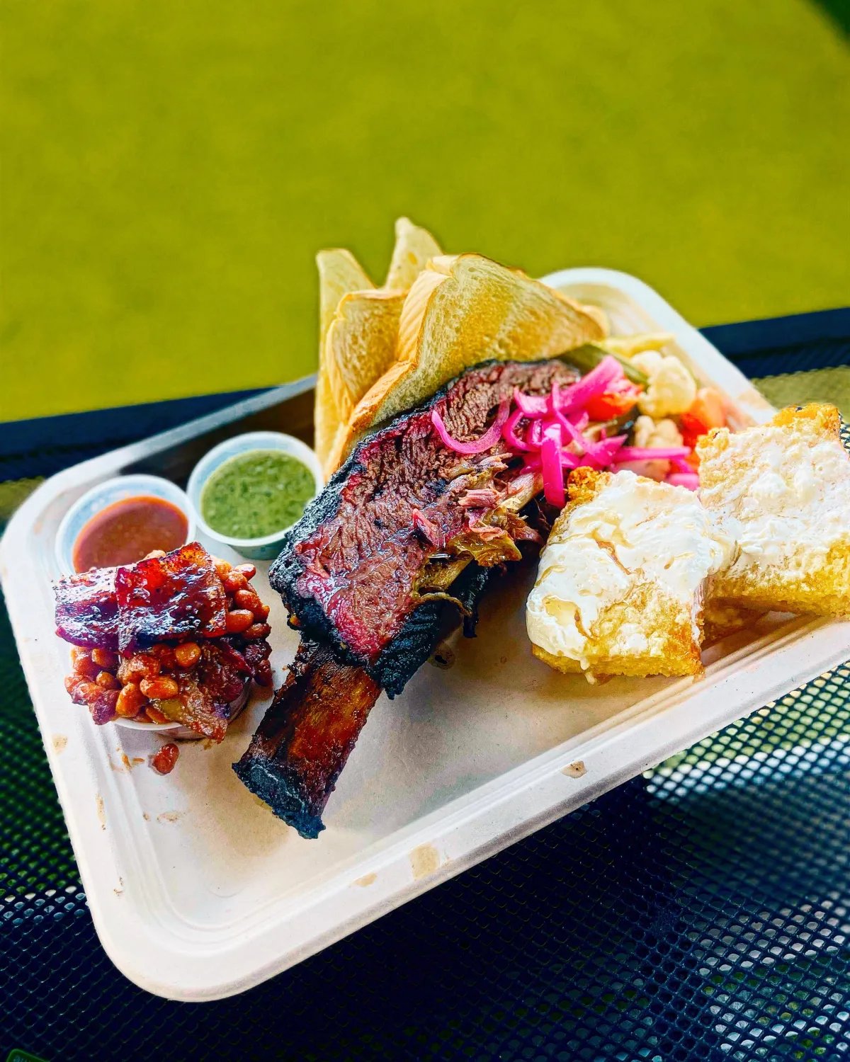 A barbecue plate with pickled onions