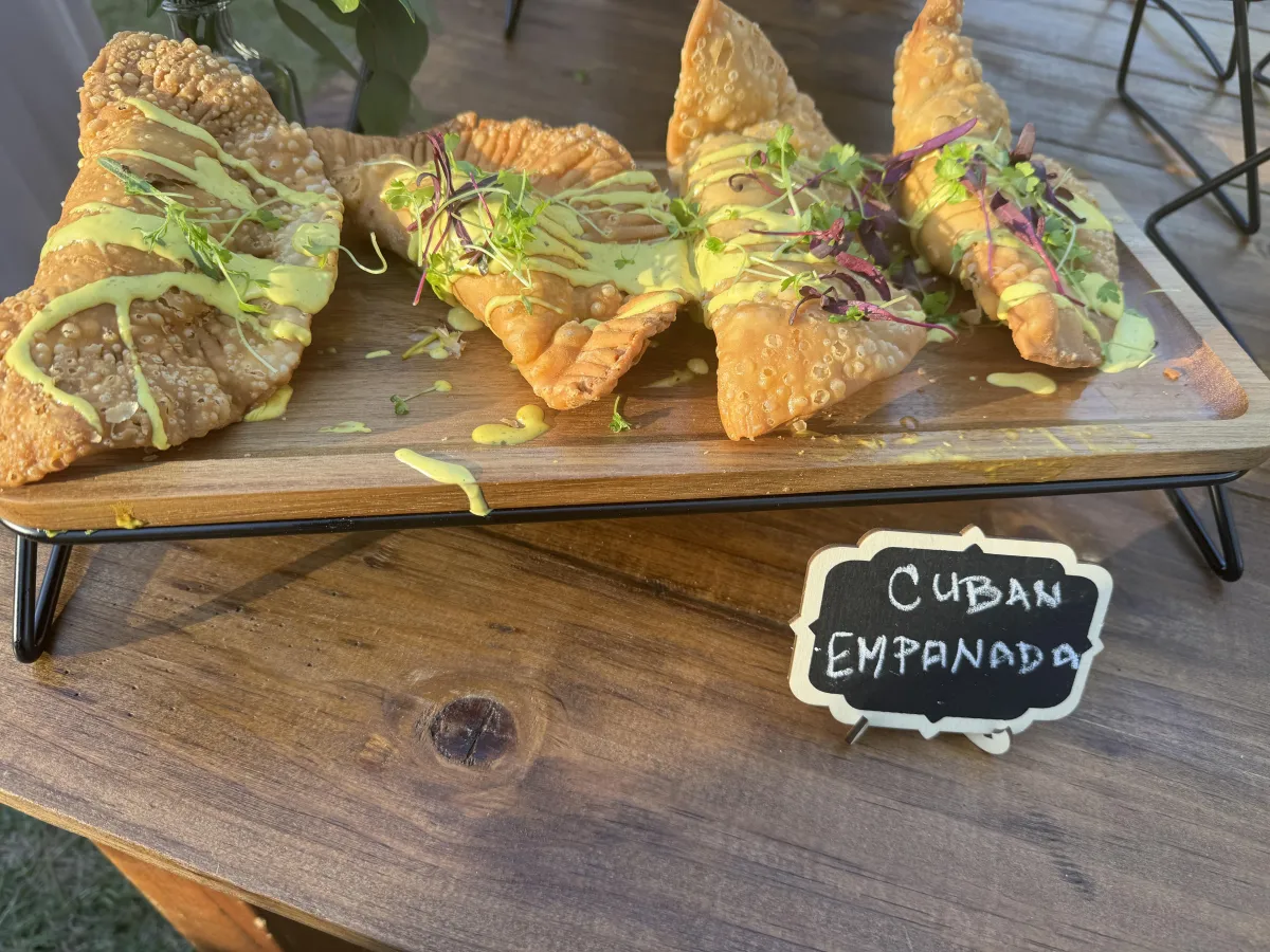 Cuban empanadas on a wooden serving board
