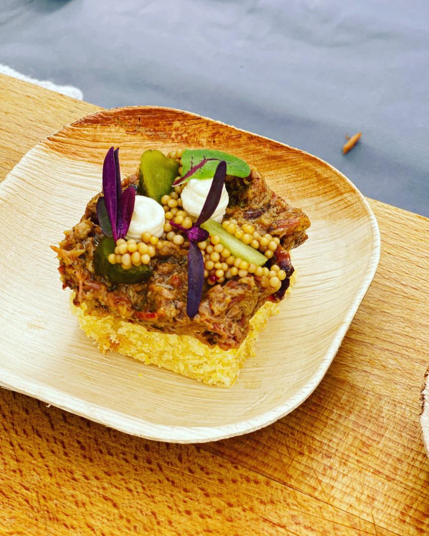 A plated starter finished with edible flowers